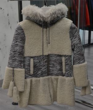 Children's coat for a girl with a cuff